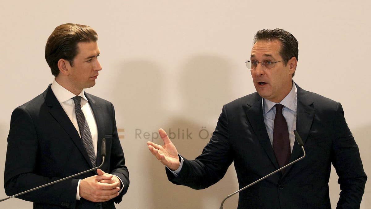 FILE - In this Tuesday, Dec. 4, 2018 file photo, Austria's Chancellor Sebastian Kurz and Austrian Vice Chancellor Heinz-Christian Strache, from left, hold a joint press conference after one year government in Austria at the Hofburg palace in Vienna, Austria. Two German newspapers are reporting that the head of Austria's far-right Freedom Party offered government contracts in return for support for his party from a potential Russian donor shortly before the Austrian's 2017 parliamentary election.
