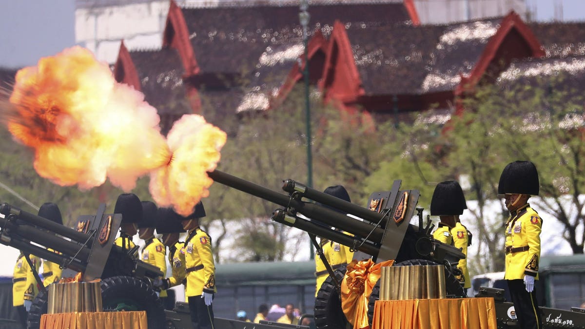 Royal Guards fire cannons in honour of Thailand's King Maha Vajiralongkorn Saturday, May 4, 2019, in Bangkok, Thailand. 