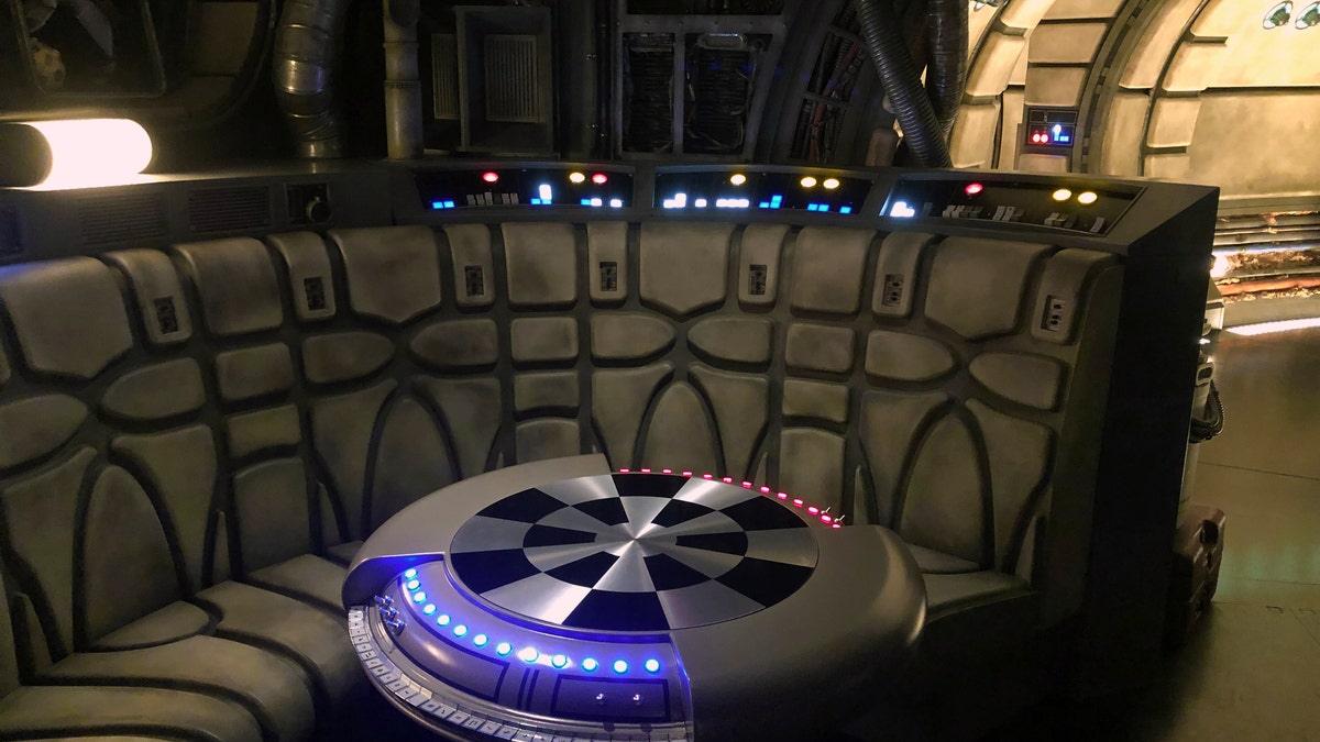 Once aboard, you and your crew wait in the ship’s main hold and lounge, where you can sit at the holo-chess (Dejarik) table or inspect other equipment around the room (lots of Star Wars Easter Eggs here too).