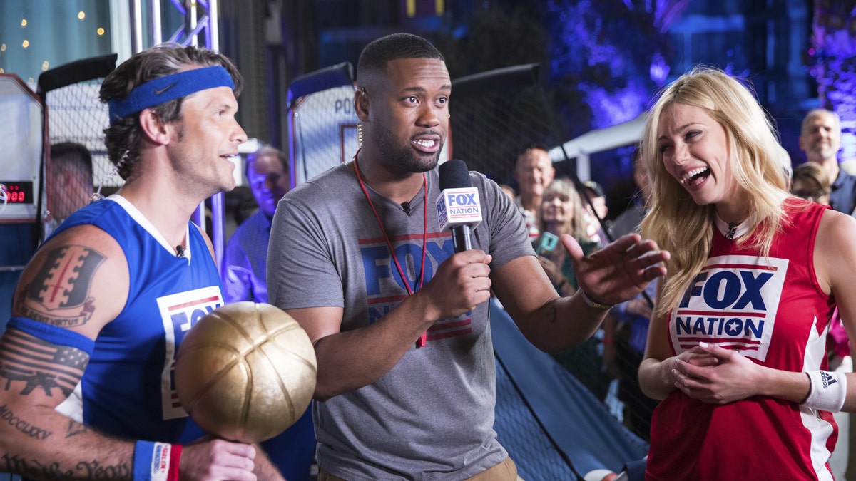 Lawrence Jones gets fans ready for the Pop-a-Shot challenge between Pete Hegseth and Abby Hornacek.
