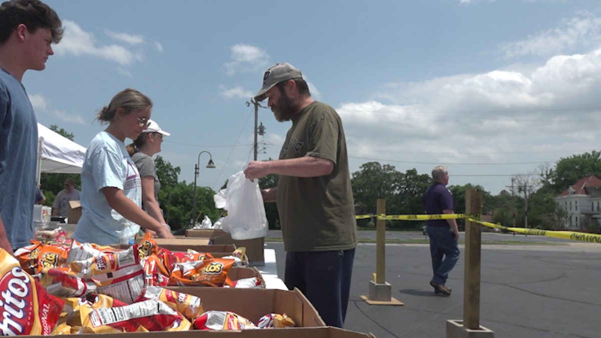 Volunteers at First Baptist Church in Fort Smith help distribute food