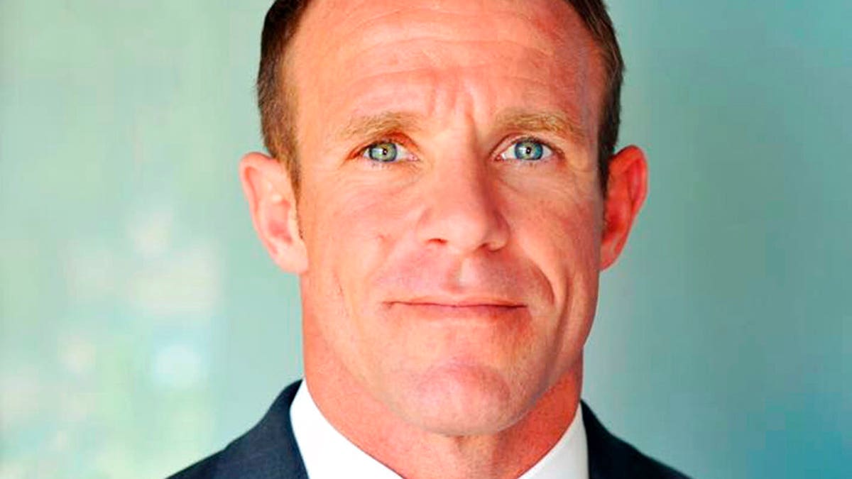 FILE - This 2018 file photo provided by Andrea Gallagher shows her husband, Navy SEAL Edward Gallagher, who has been charged with murder in the 2017 death of an Iraqi war prisoner. (Andrea Gallagher via AP, File)