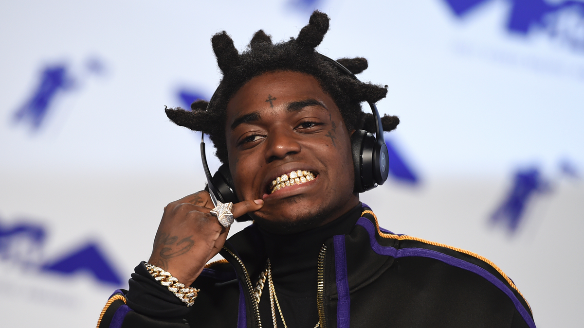 FILE - In this Aug. 27, 2017 file photo, Kodak Black arrives at the MTV Video Music Awards at The Forum in Inglewood, Calif. Officials say Florida rapper Kodak Black was arrested on federal and state weapons charges just before he was to perform at a hip-hop festival. The U.S. Marshals office says in a news release that the 21-year-old Black was taken into custody Saturday, May 11, 2019 at the Rolling Loud Music Festival at Hard Rock Stadium in Miami Gardens. The statement didn’t elaborate.(Photo by Jordan Strauss/Invision/AP, File)