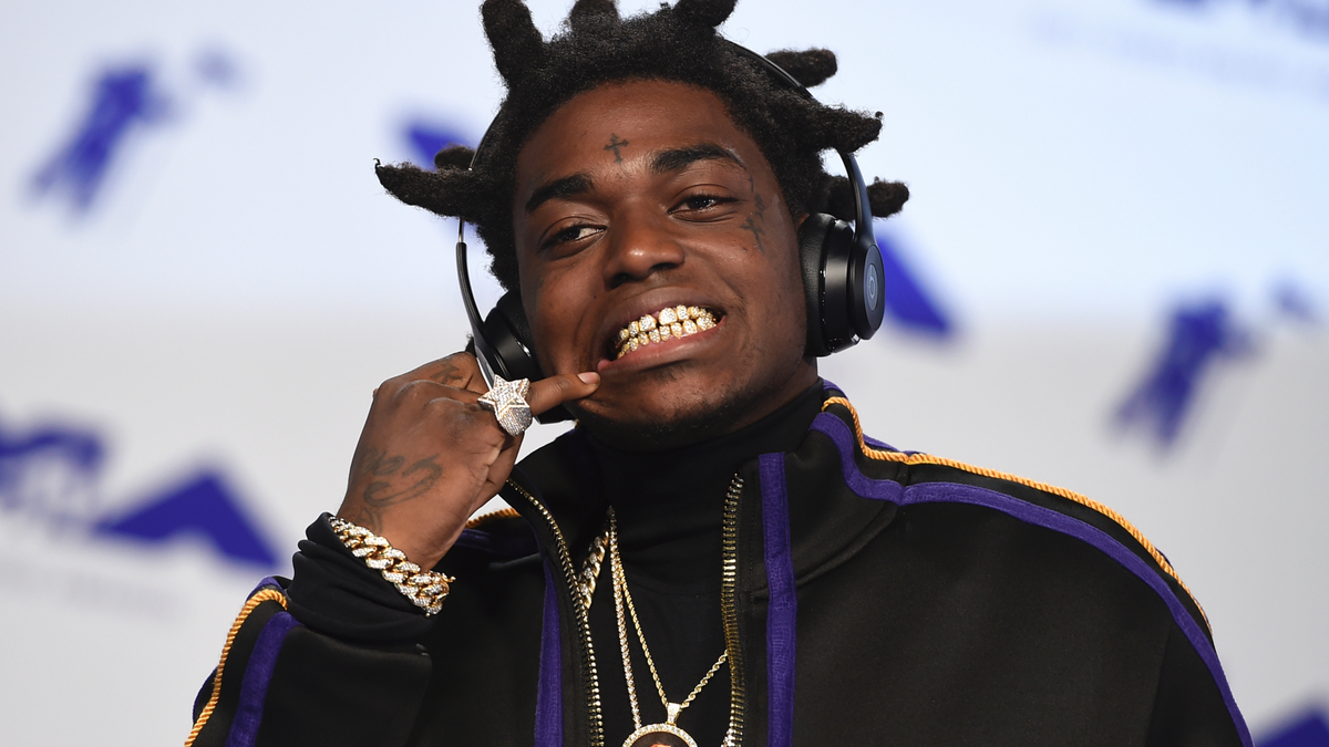 FILE - In this Aug. 27, 2017 file photo, Kodak Black arrives at the MTV Video Music Awards at The Forum in Inglewood, Calif. Officials say Florida rapper Kodak Black was arrested on federal and state weapons charges just before he was to perform at a hip-hop festival. The U.S. Marshals office says in a news release that the 21-year-old Black was taken into custody Saturday, May 11, 2019 at the Rolling Loud Music Festival at Hard Rock Stadium in Miami Gardens. The statement didn’t elaborate.(Photo by Jordan Strauss/Invision/AP, File)