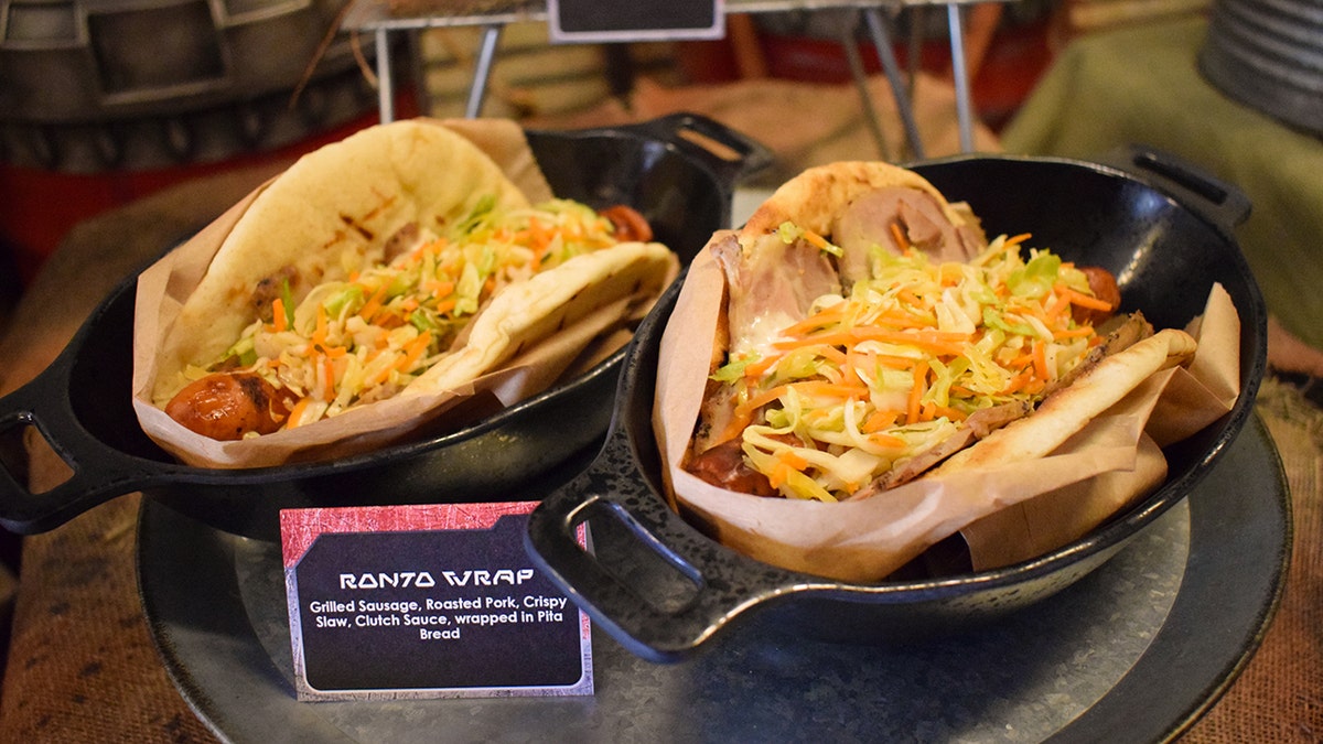 The grab and go, walk around sandwich option is a BBQ Ronto Wrap. A grilled sausage with roasted pork, slaw, and wrapped in a pita bread is tastier than the dinosaur-like Star Wars creature from Tatooine might imply.