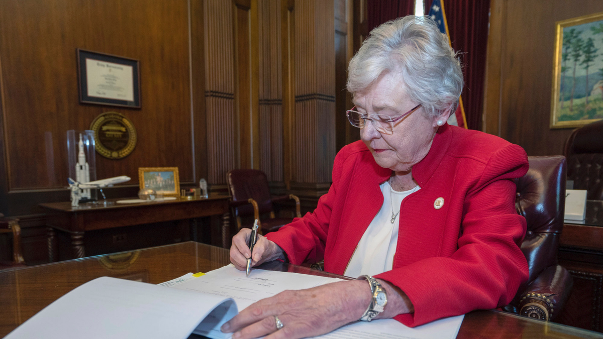 Alabama Gov. Kay Ivey signs the state's abortion bill into law, May 15, 2019, in Montgomery. Ala. Republicans who support the measure hope challenges to the law will be used by conservative justices on the U.S. Supreme Court to overturn the Roe v. Wade decision which legalized abortion nationwide. (Associated Press)