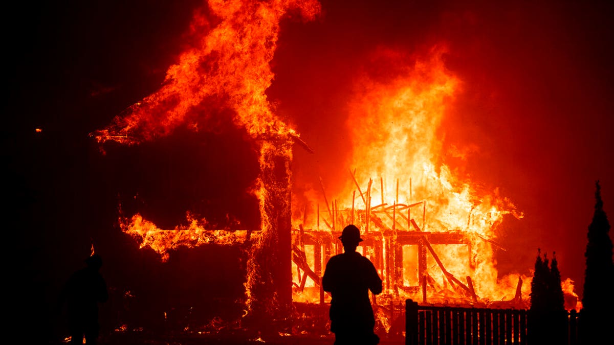 A home burns as the Camp Fire rages through Paradise, Calif,. on Nov. 8, 2018. (AP Photo/Noah Berger,File)