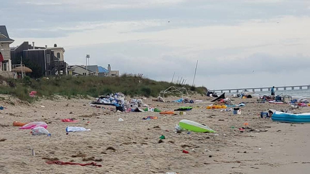 Heaps of trash can be seen at Chic's Beach in Virginia Beach, Va. on Monday after "Floatopia" drew rowdy beachgoers.