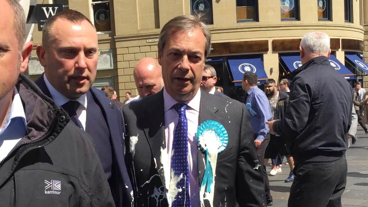 Brexit Party leader Nigel Farage after being hit with a milkshake during a campaign walkabout for the upcoming European elections in Newcastle, England, Monday May 20, 2019. 