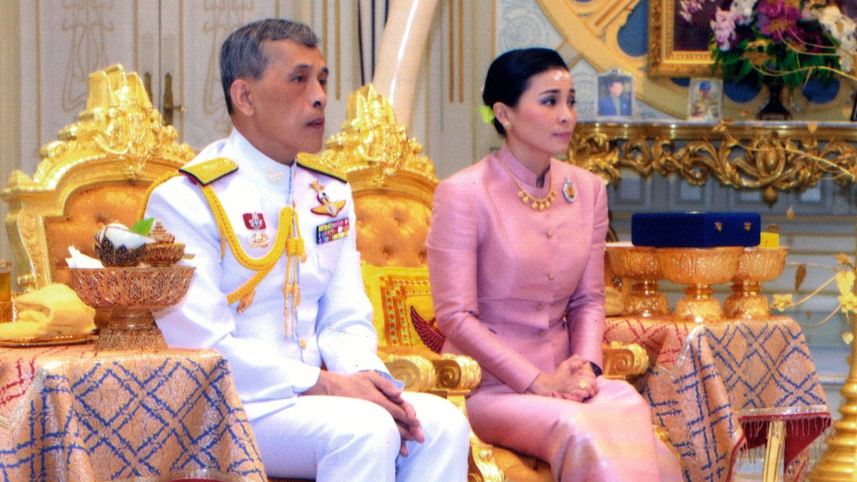 In this photo released by Bureau of the Royal Household,Thailand's King Maha Vajiralongkorn Bodindradebayavarangkun, left, sits with Queen Suthida Vajiralongkorn Na Ayudhya at Ampornsan Throne Hall in Bangkok, Thailand, Wednesday, May 1, 2019. 