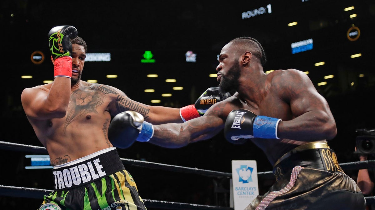 Dominic Breazeale, left, evades a right from Deontay Wilder during the first round of the WBC heavyweight championship boxing match Saturday, May 18, 2019, in New York. Wilder won in the first round.