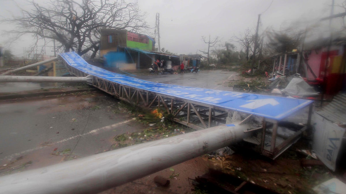 Damaged signage lies on a street in Puri district after Cyclone Fani hit the coastal eastern state of Odisha, India, Friday, May 3, 2019. (AP Photo)