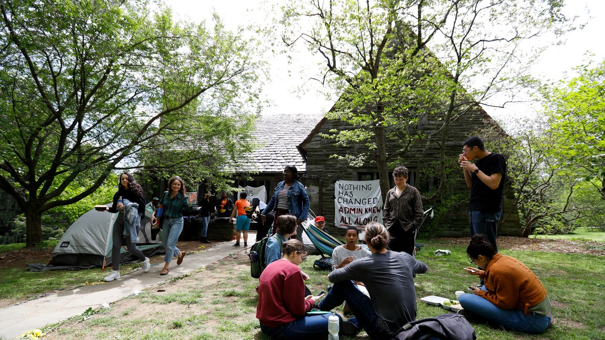 Swarthmore College students gather outside the Phi Psi fraternity house during a sit-in, Monday, April 29, 2019, in Swarthmore, Pa.