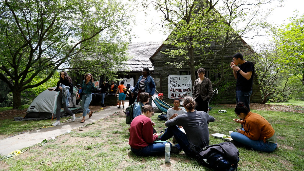 Swarthmore College students gather outside the Phi Psi fraternity house during a sit-in, Monday, April 29, 2019, in Swarthmore, Pa.