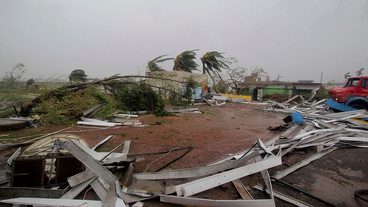 Damaged structures and uprooted trees lie along a road in Puri district after Cyclone Fani hit the coastal eastern state of Odisha. (AP Photo)