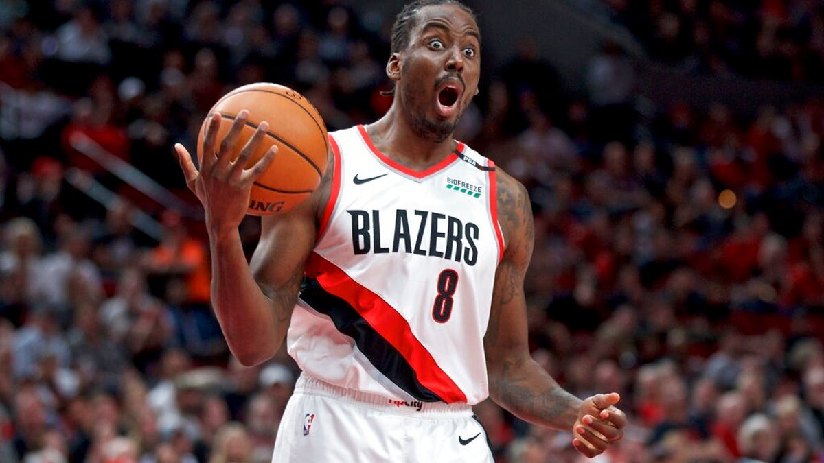 Portland Trail Blazers forward Al-Farouq Aminu reacts after being called for a foul against the Denver Nuggets during overtime of Game 3 of an NBA basketball second-round playoff series Friday, May 3, 2019, in Portland, Ore.