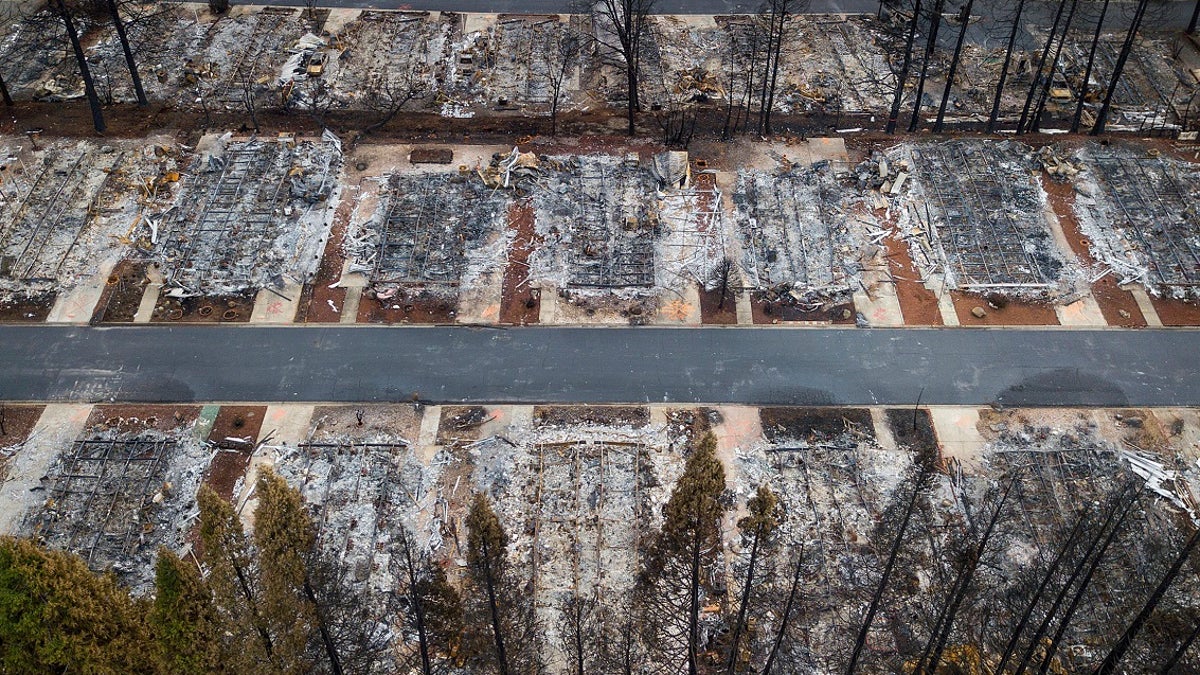 This Dec. 3 photo shows homes leveled by the Camp Fire line the Ridgewood Mobile Home Park retirement community in Paradise, Calif. (Associated Press)