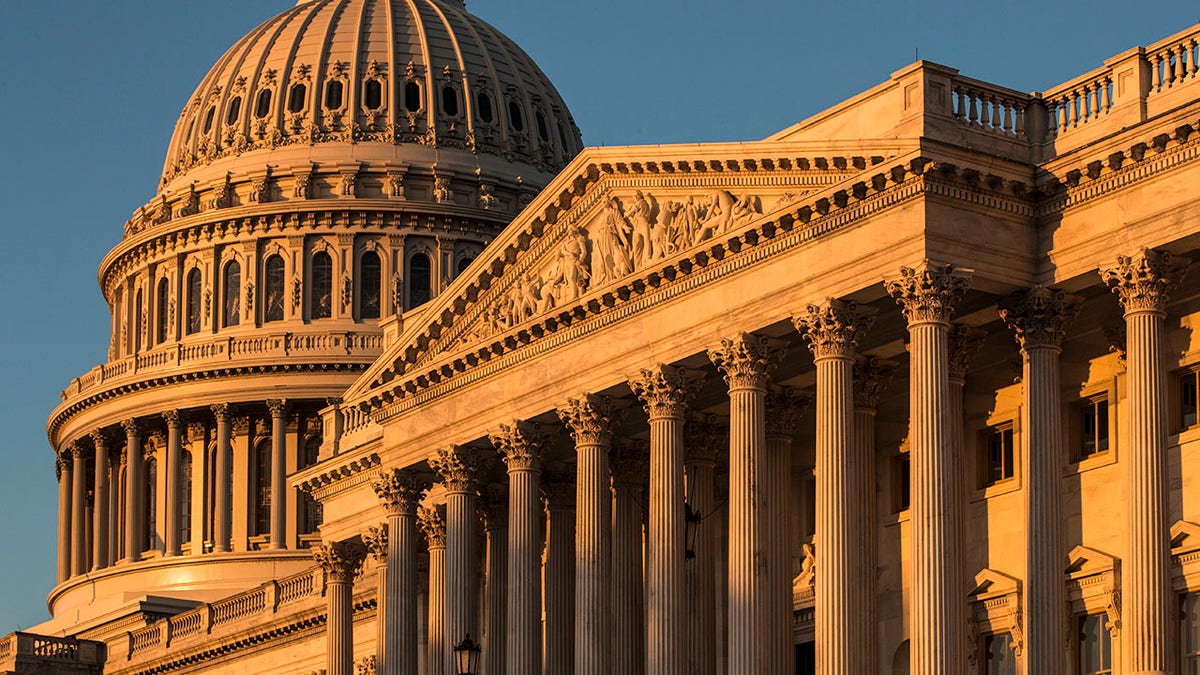 FILE - This Oct. 1, 2018, file photo, shows the Capitol at sunrise in Washington. A handful of senior House lawmakers, frustrated by more than a decade of frozen congressional salaries, are quietly exploring whether to accept an annual pay raise that they’ve shunned since Barack Obama was first president. (AP Photo/J. Scott Applewhite, File)