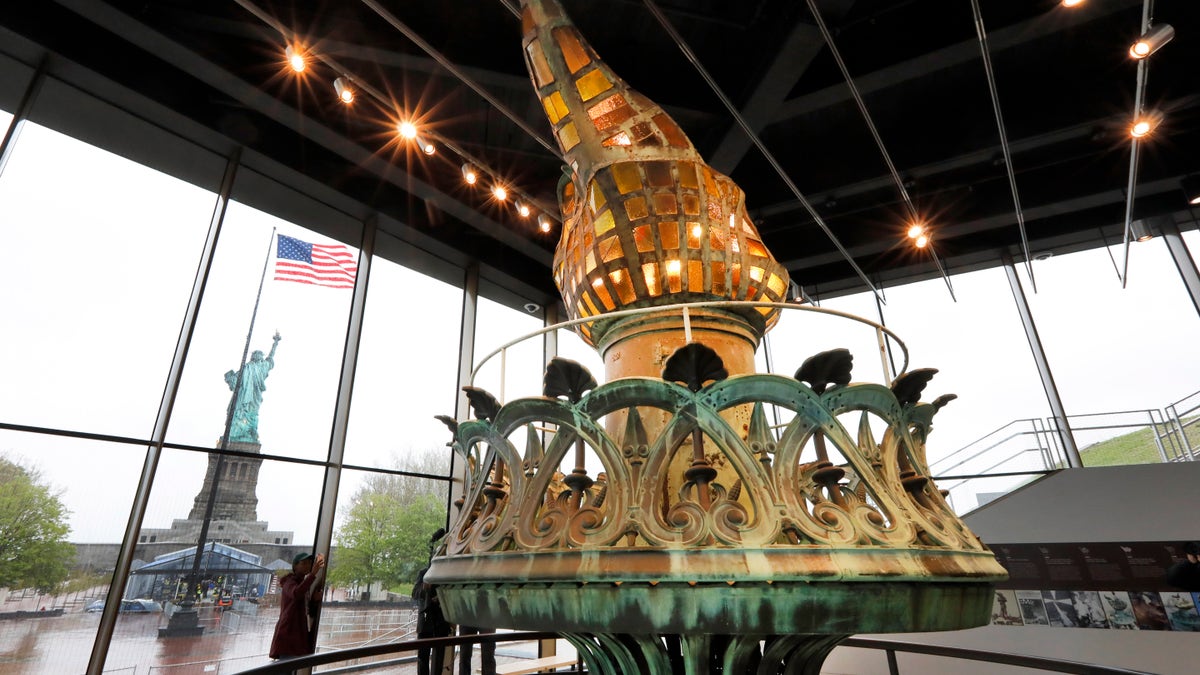 The original torch and flame are displayed in the new Statue of Liberty Museum, on Liberty Island, in New York, Monday, May 13, 2019.