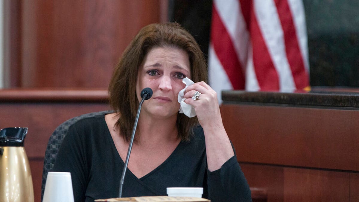 Amber Jones cries from the witness stand while being questioned by 11th Circuit deputy Solicitor Suzanne Mayes during the trial of her ex husband, Tim Jone. 