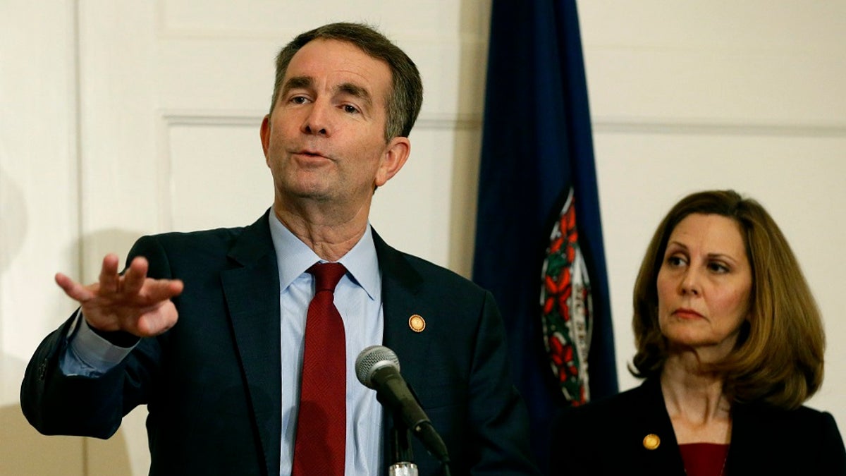Virginia Gov. Ralph Northam, left, gestures as his wife, Pam, listens during a Feb. 2 news conference in the Governors Mansion at the Capitol in Richmond, Va.