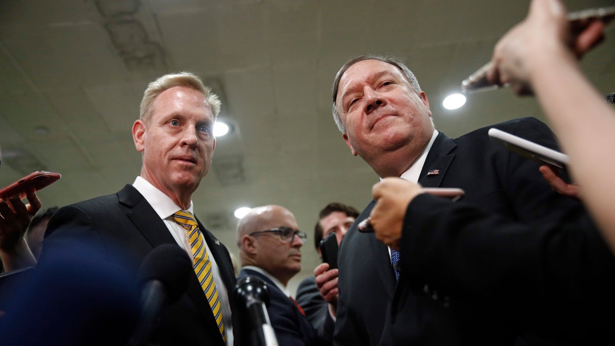 Acting Defense Secretary Patrick Shanahan, left, and Secretary of State Mike Pompeo speak to members of the media after a classified briefing for members of Congress on Iran, Tuesday, May 21, 2019, on Capitol Hill in Washington. (AP Photo/Patrick Semansky)