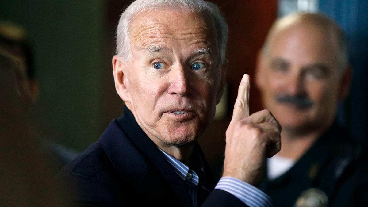 In this May 13, 2019, photo, former vice president and Democratic presidential candidate Joe Biden interacts with a supporter during a campaign stop at the Community Oven restaurant in Hampton, N.H. (AP Photo/Michael Dwyer, File)