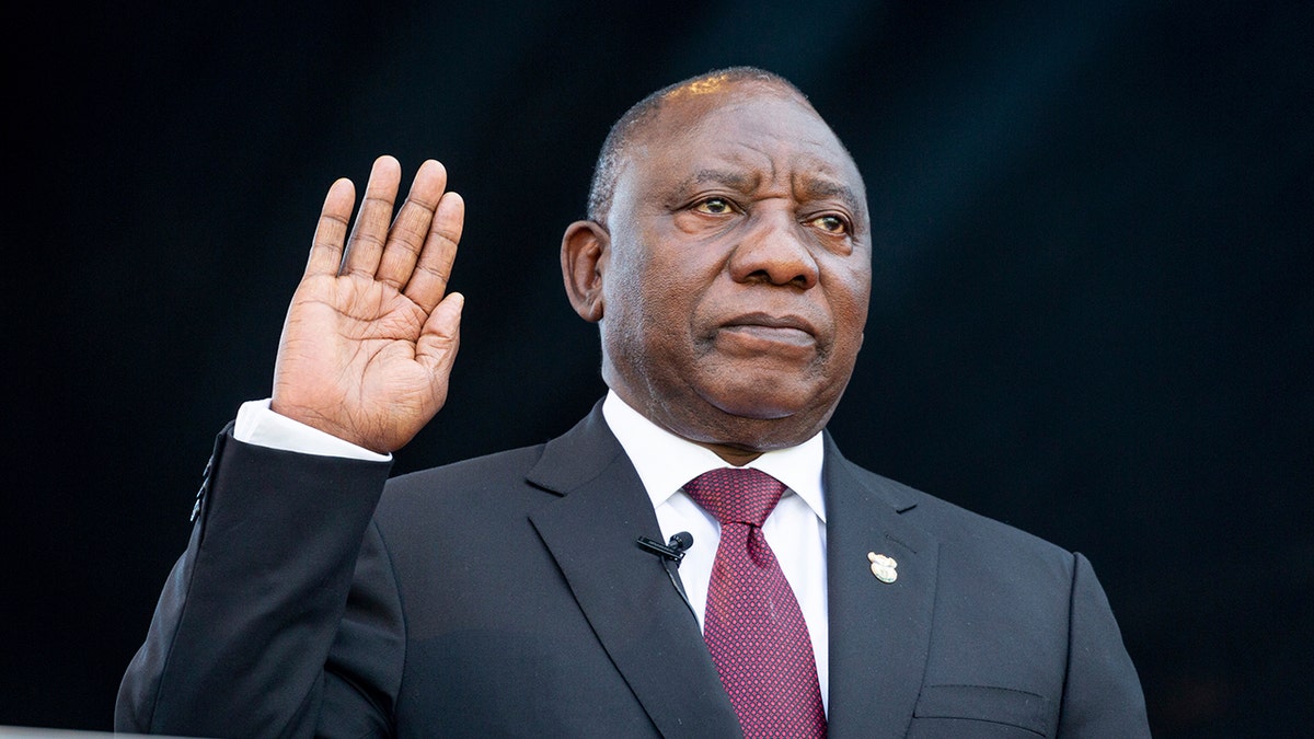 South African President Cyril Ramaphosa, right, takes the Oath of Office at the Loftus Versfeld Stadium in Pretoria, South Africa. (Yeshiel Panchia/Pool Photo via AP)