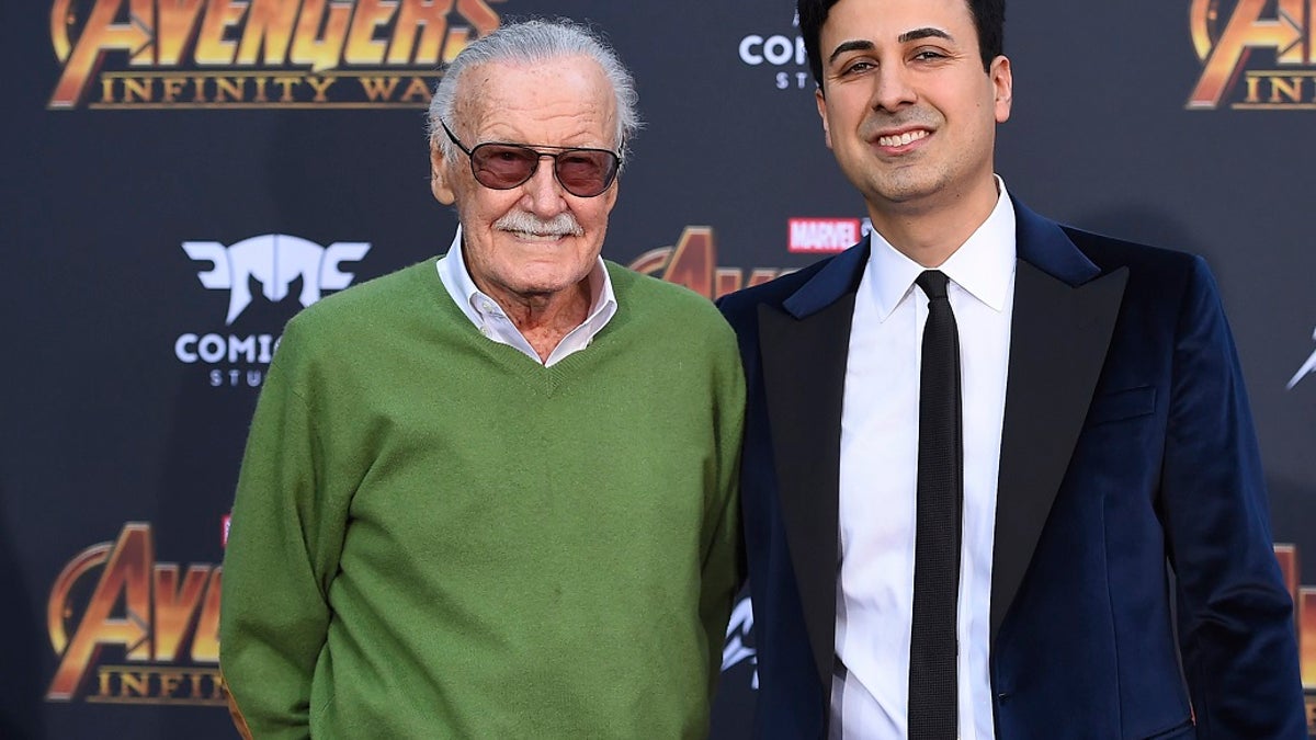 In this April 23, 2018, file photo, Stan Lee, left, and Keya Morgan arrive at the world premiere of "Avengers: Infinity War" in Los Angeles. Morgan, the former business manager of Lee has been arrested on elder abuse charges involving the late comic book icon. (Photo by Jordan Strauss/Invision/AP, File)