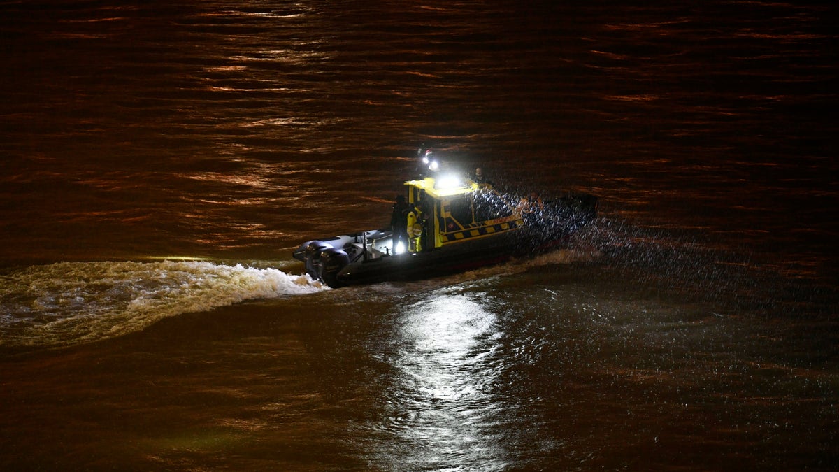 A rescue boat searching for victims Wednesday night. (Zsolt Szigetvary/MTI via AP)