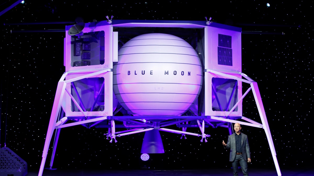 Jeff Bezos speaks in front of a model of Blue Origin's Blue Moon lunar lander, Thursday, May 9, 2019, in Washington D.C.. (AP Photo/Patrick Semansky)
