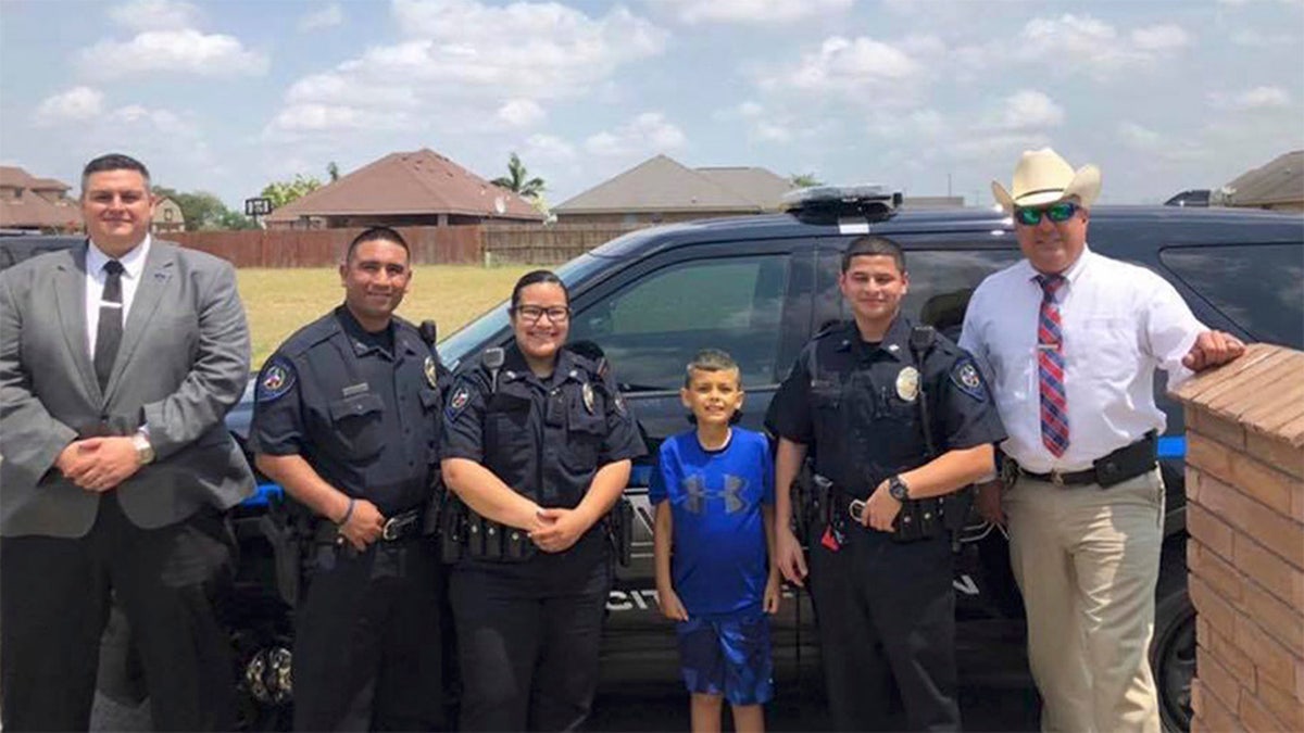 Officers visit with Brandon Tadeo Alvarez, a 9-year-old battling cancer. 