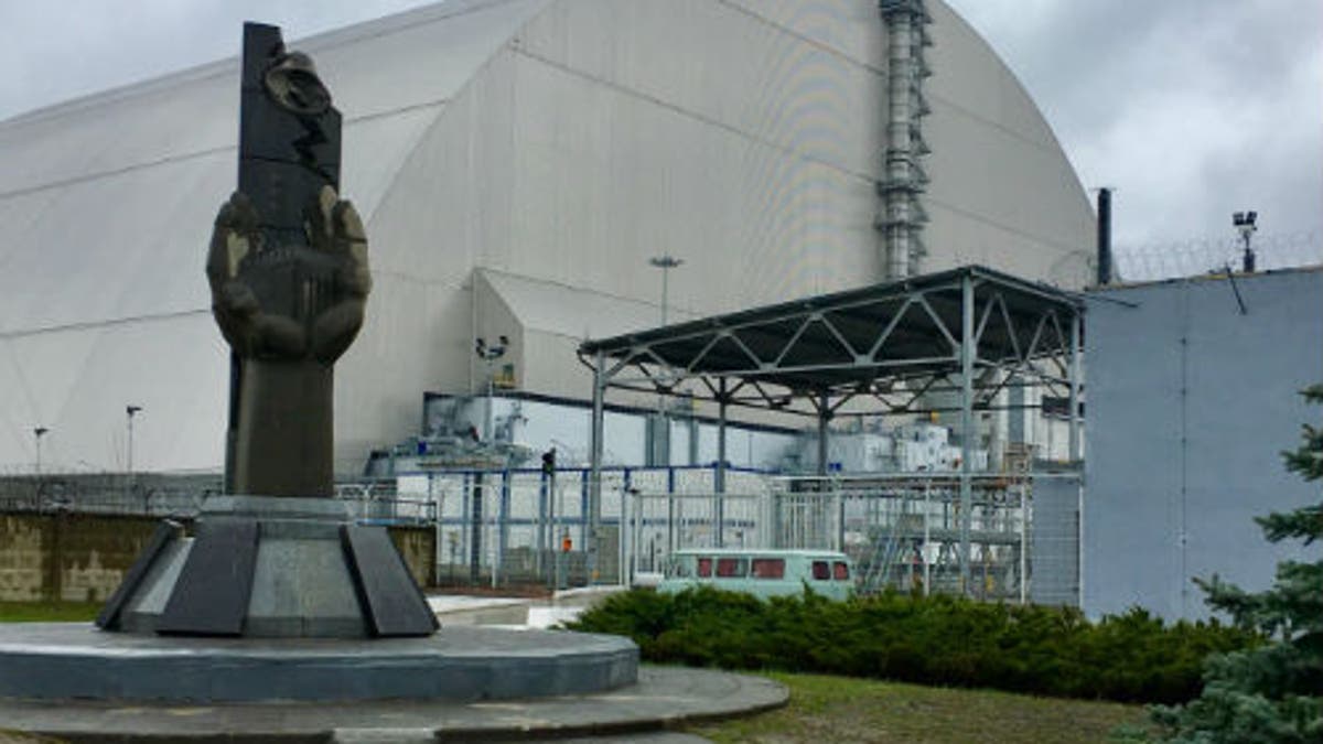 The safe confinement structure surrounding the sarcophagus built around the Chernobyl reactor.