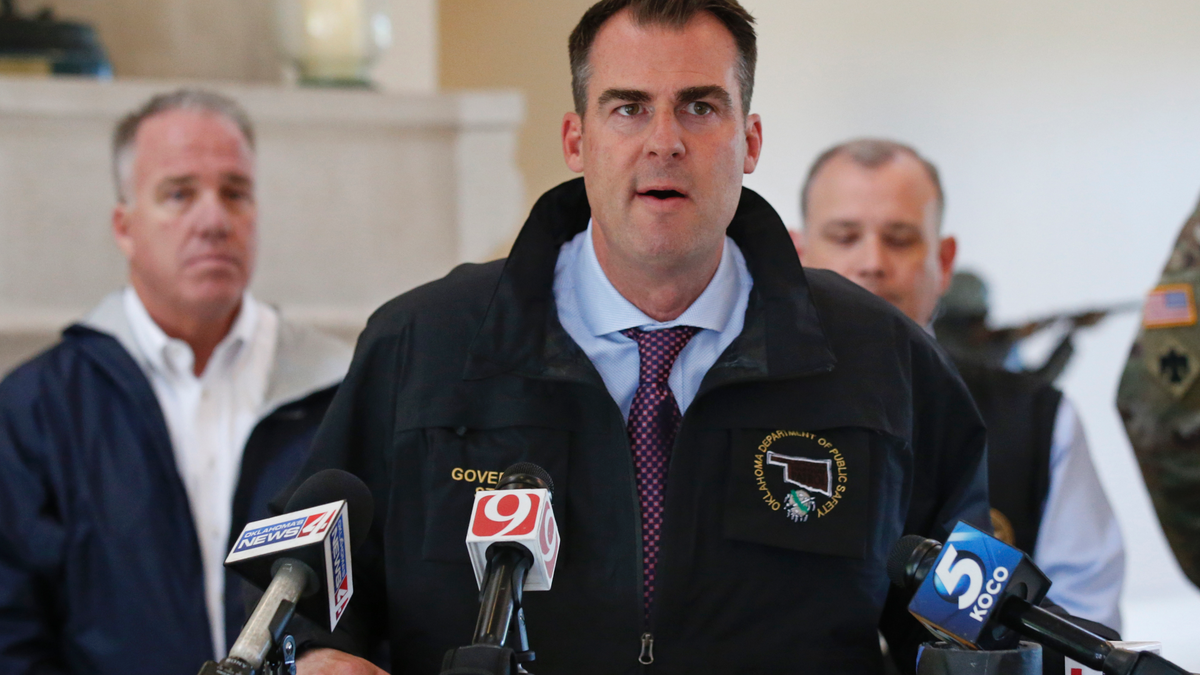 Oklahoma Gov. Kevin Stitt talks with the media following an aerial tour of tornado- and flood-damaged areas of the state, Tuesday, May 21, 2019, in Oklahoma City. (AP Photo/Sue Ogrocki)