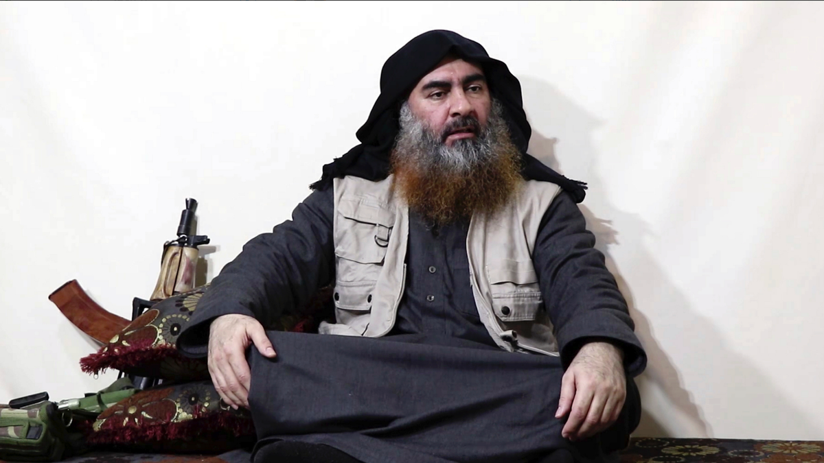 This file image made from video posted on a militant website Monday, April 29, 2019, purports to show the leader of the Islamic State group, Abu Bakr al-Baghdadi, being interviewed by his group's Al-Furqan media outlet. No longer burdened by territory and administration, Islamic State group leader Abu Bakr al-Baghdadi outlined the new path forward for his group: Widen your reach, connect with far-flung militant groups and exhaust your enemies with a “war of attrition.” (Al-Furqan media via AP, File)