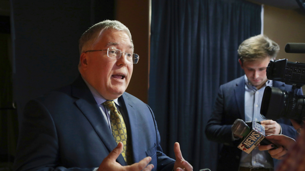 FILE - In this Nov. 1, 2018, file photo, Patrick Morrisey speaks to reporters after a debate in Morgantown, W.Va. (AP Photo/Raymond Thompson, File)