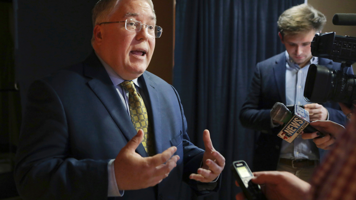 FILE - In this Nov. 1, 2018, file photo, Patrick Morrisey speaks to reporters after a debate in Morgantown, W.Va. (AP Photo/Raymond Thompson, File)