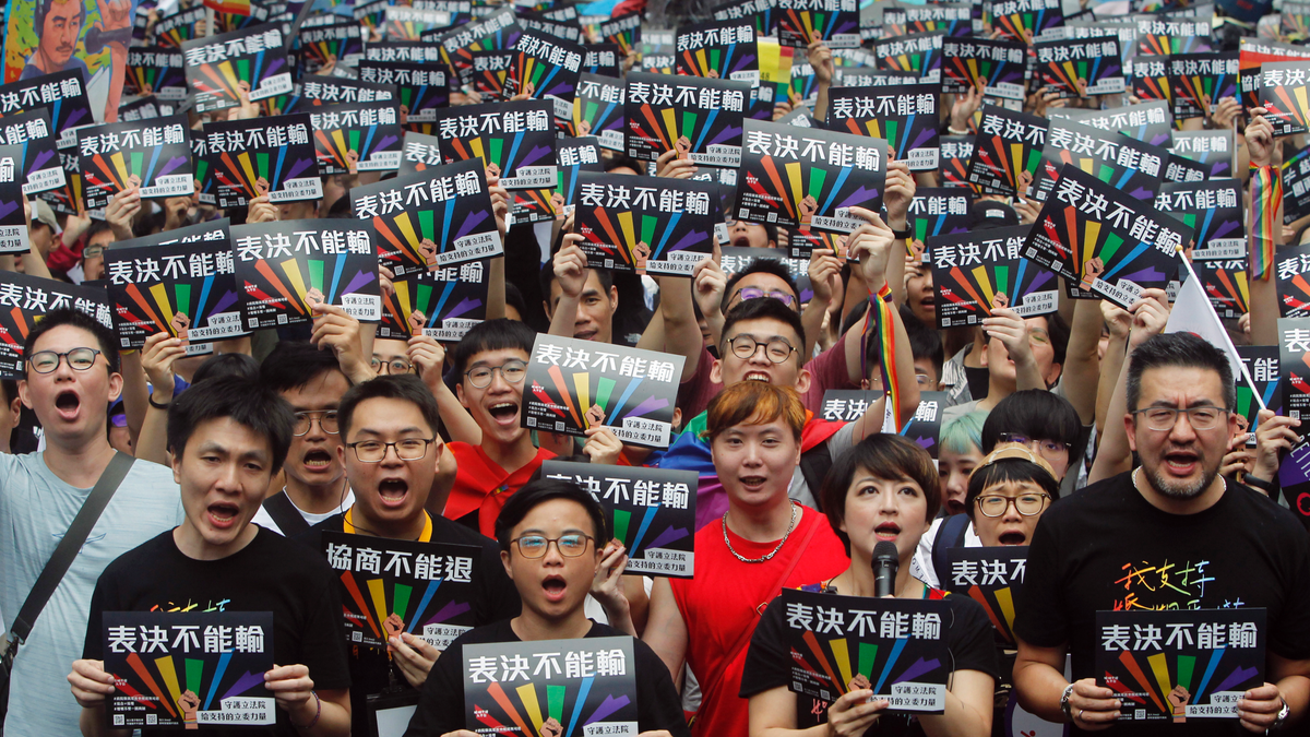 Same-sex marriage supporters gather outside the Legislative Yuan in Taipei, Taiwan, on Friday. (Associated Press)