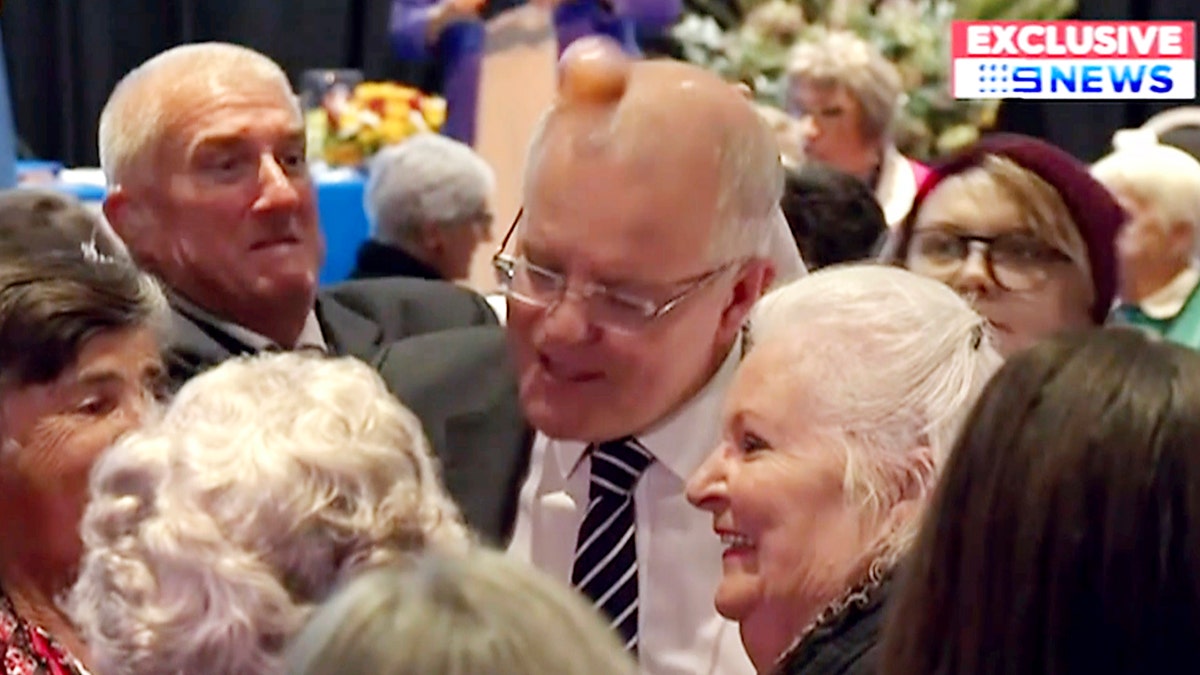 In this image made from video, an egg hits the head of Australian Prime Minister Scott Morrison as he spoke to a rural women's conference in the town of Albury, Australia.