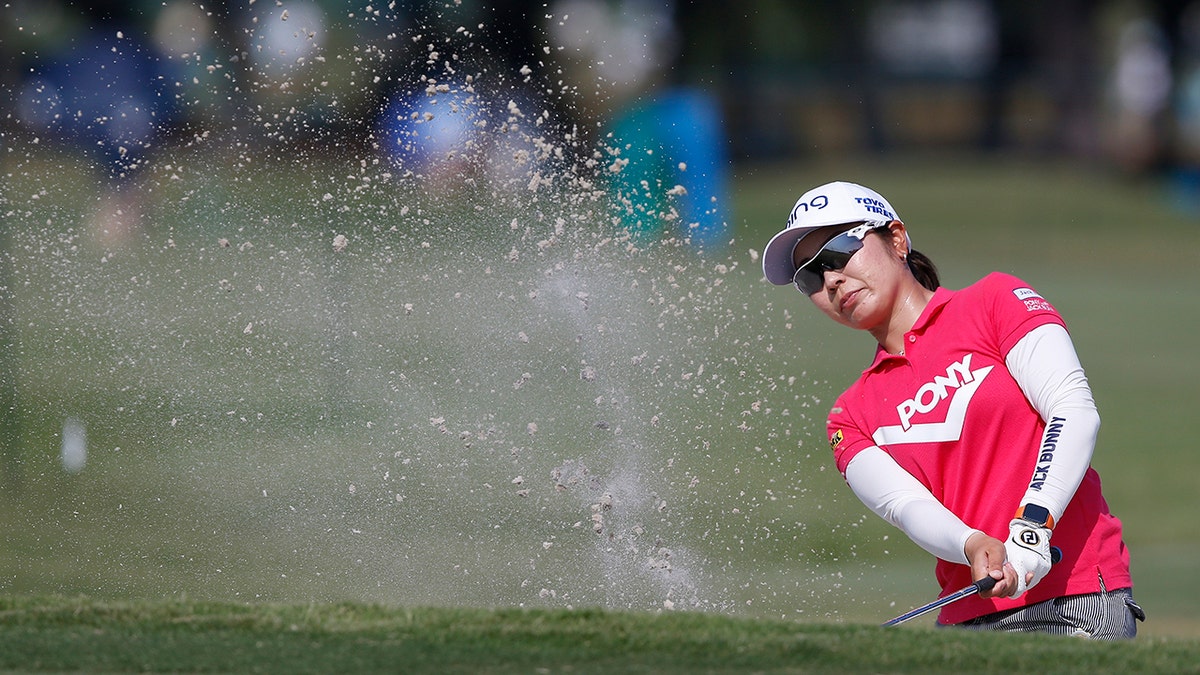 Mamiko Higa of Japan, hits out of the bunker for a birdie on the 9th green during the first round of the U.S. Women's Open golf tournament, Thursday, May 30, 2019, in Charleston, S.C. (AP Photo/Mic Smith)