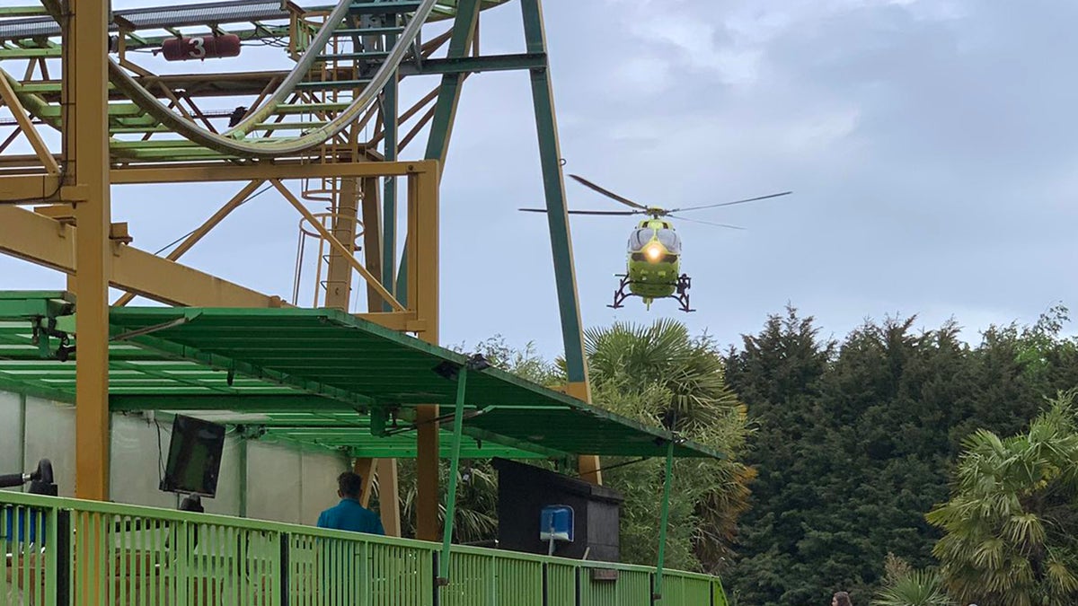 An air ambulance arrives to attend to a boy who fell from a roller coaster at Lightwater Valley theme park. (Photo by Simon Moran/Getty Images)