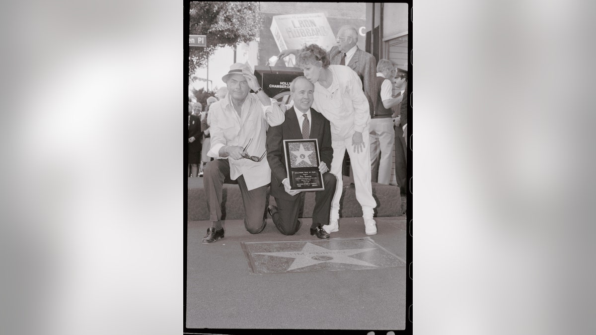 Actor Tim Conway (C) gets a kiss on the head from Carol Burnett (R) and an elbow in the shoulder from actor Harvey Korman (L) after receiving his star on Hollywood Blvd. Conway was awarded the 186th star on the Hollywood walk of fame.