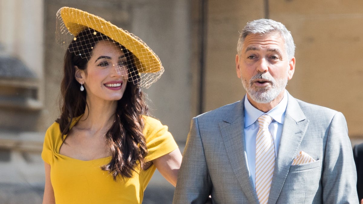 Amal Clooney couldn't help but gush over her husband George Clooney?during her virtual book launch on Wednesday.?