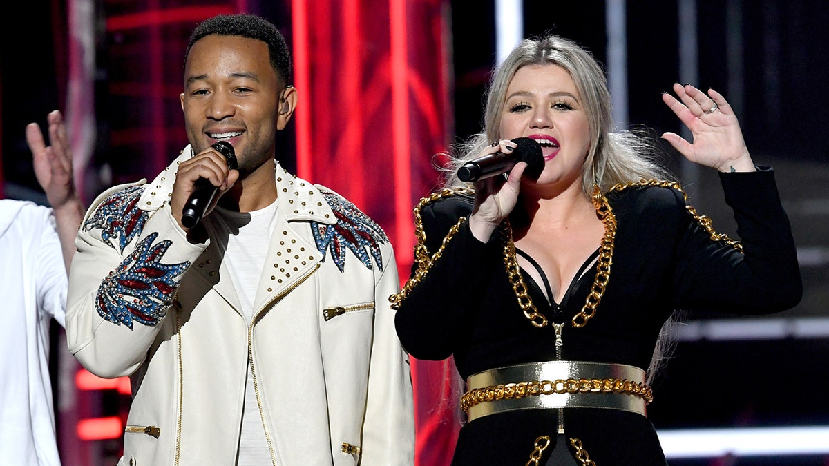 Voice' judges Kelly Clarkson, John Legend called 'unpatriotic' for