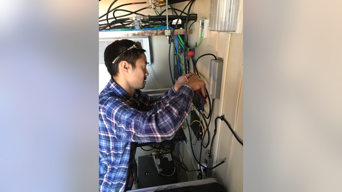 MuralNet Founder Brian Shih helping Niles Radio Communications as they install equipment on the Long Mesa Tower. (MuralNet)