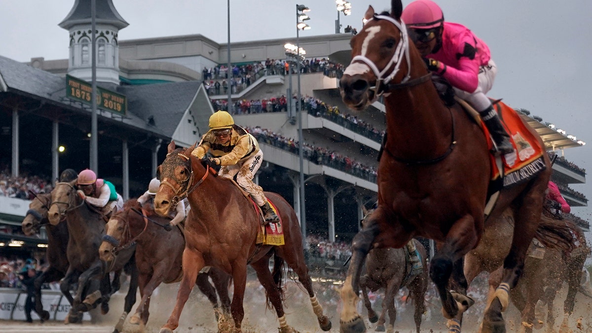 Luis Saez rides Maximum Security, right, across the finish line first against Flavien Prat on Country House during the 145th running of the Kentucky Derby horse race at Churchill Downs Saturday, May 4, 2019, in Louisville, Ky. Country House was declared the winner after Maximum Security was disqualified following a review by race stewards.