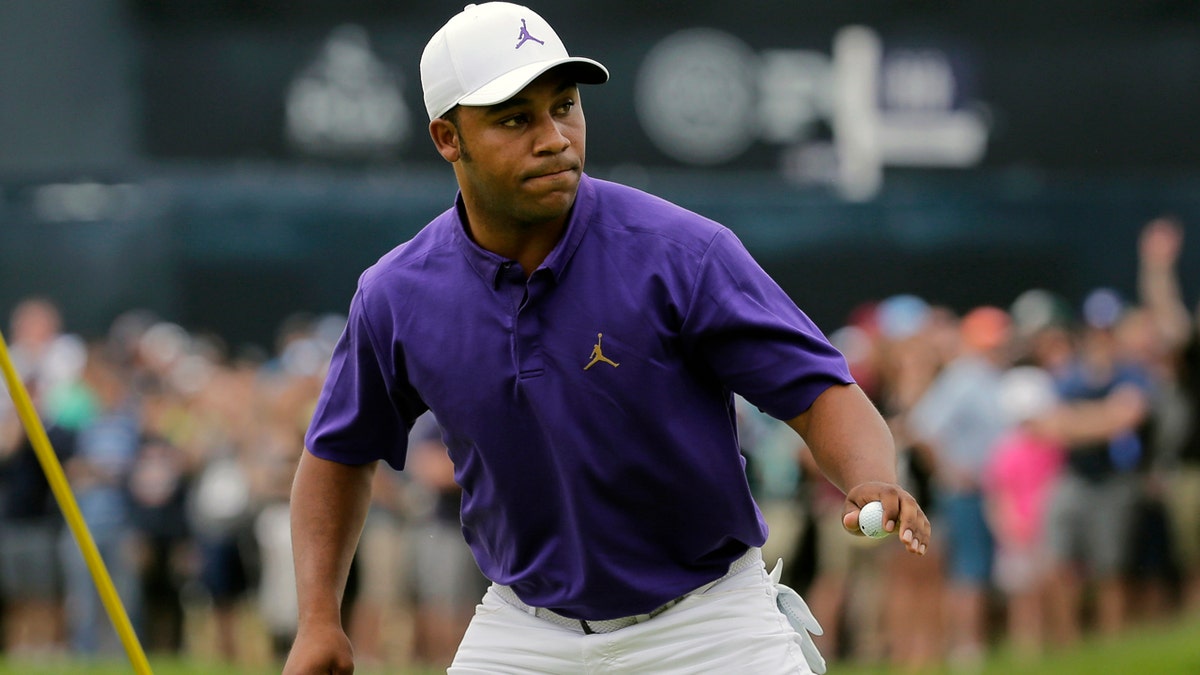 Harold Varner III reacts after sinking a putt for birdie on the first green during the final round of the PGA Championship golf tournament, Sunday, May 19, 2019, at Bethpage Black in Farmingdale, N.Y. (AP Photo/Seth Wenig)