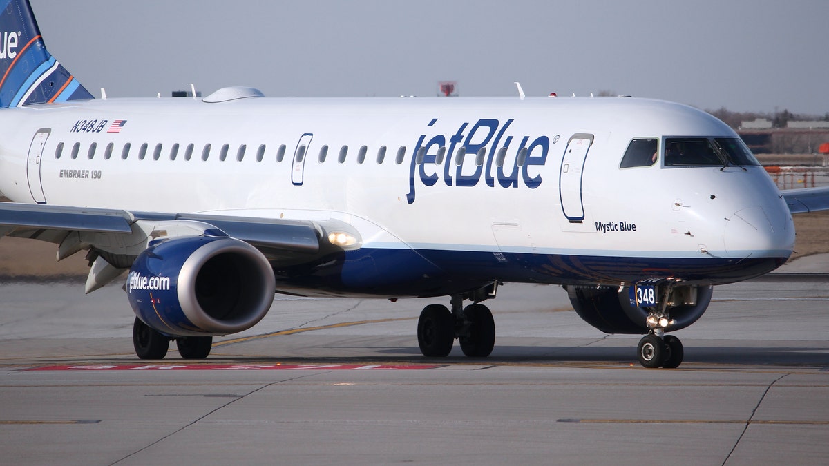 Jetblue Embraer taxies after landing at O'Hare Airport in Chicago. JetBlue is an American low-cost airline with 5.4 bn USD revenue in 2013.