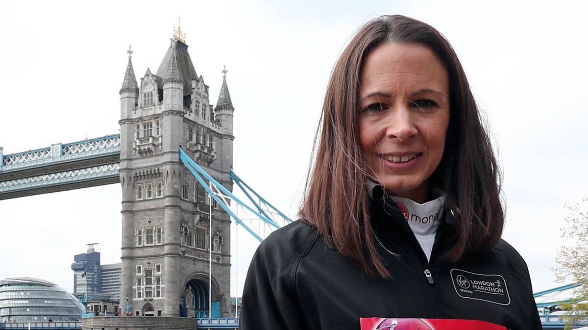 Jo Pavey poses for photographers during a photocall at Tower Hotel, London, ahead of the London Marathon. (Photo by Gareth Fuller/PA Images via Getty Images)