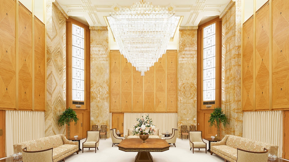 Dubbed "the beacon on the hill" because of its bright lights visible for miles at night, the 90,000-square-foot temple is known for its imposing granite walls, monolithic architecture, and five golden spires, the tallest reaching 170 feet.